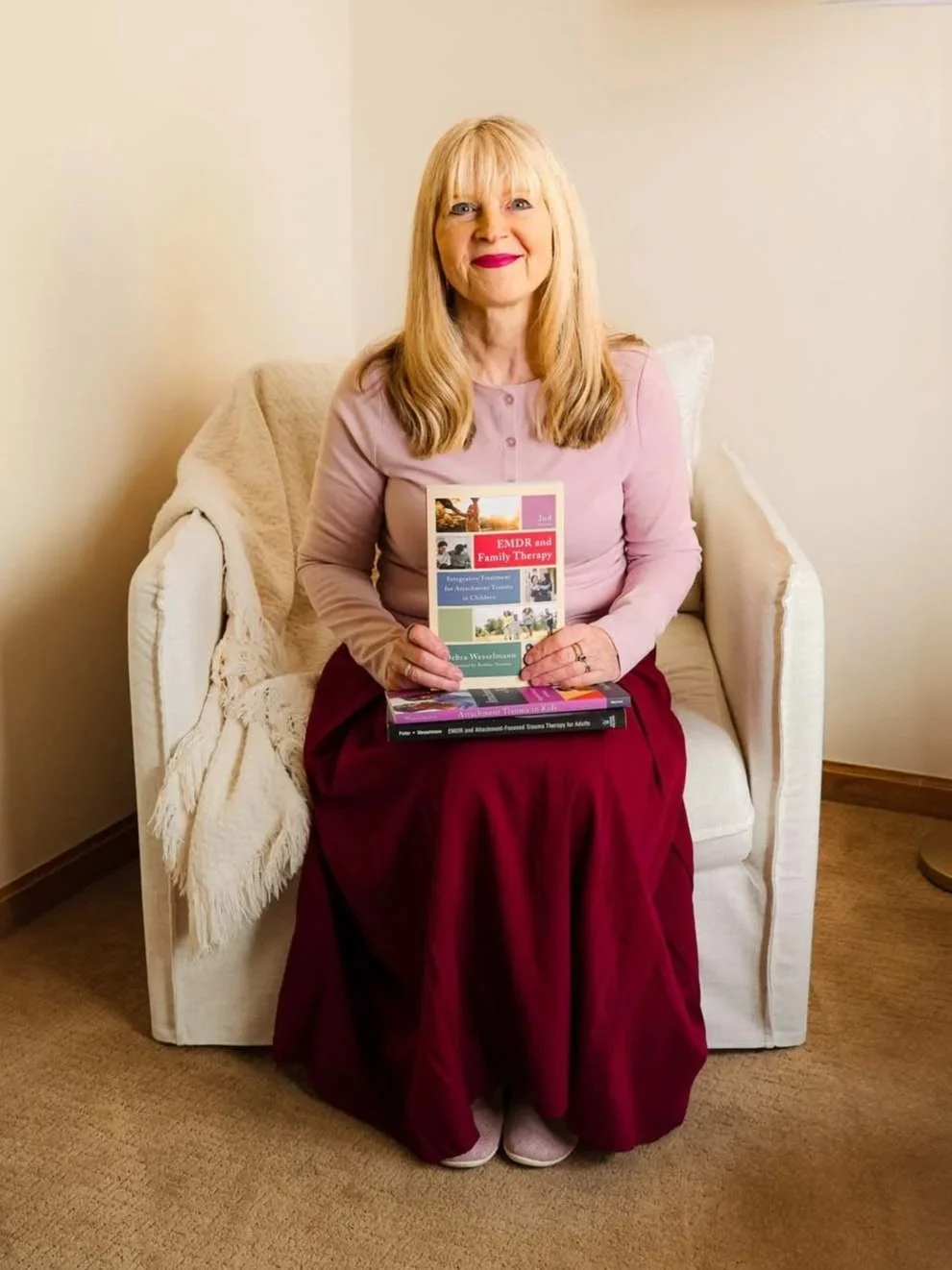 Debra Wesselmann, EMDR therapist and attachment trauma author, smiling in professional portrait