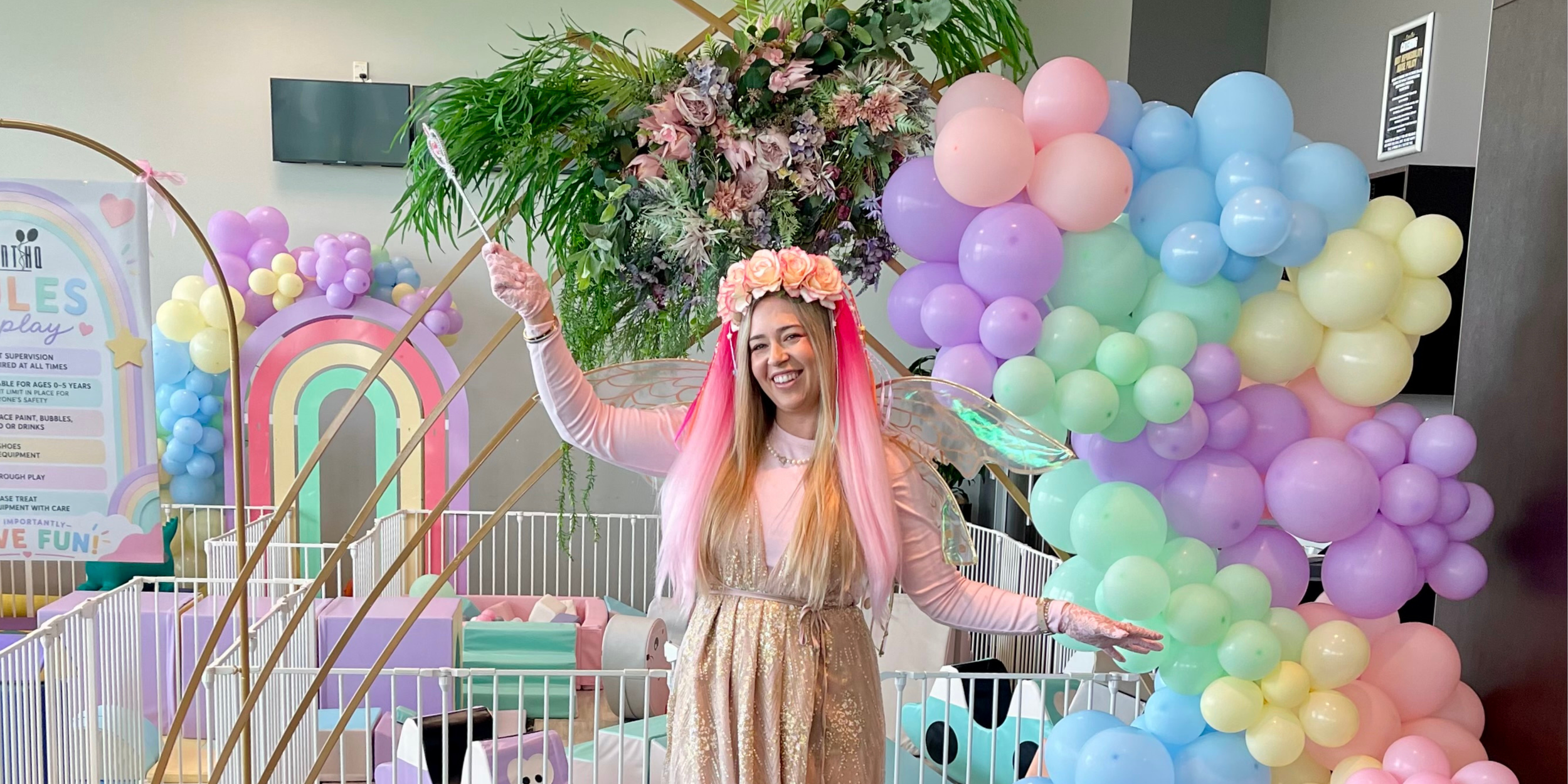 Art deco backdrop with floral arrangement and balloon garlands in Palmerston North.