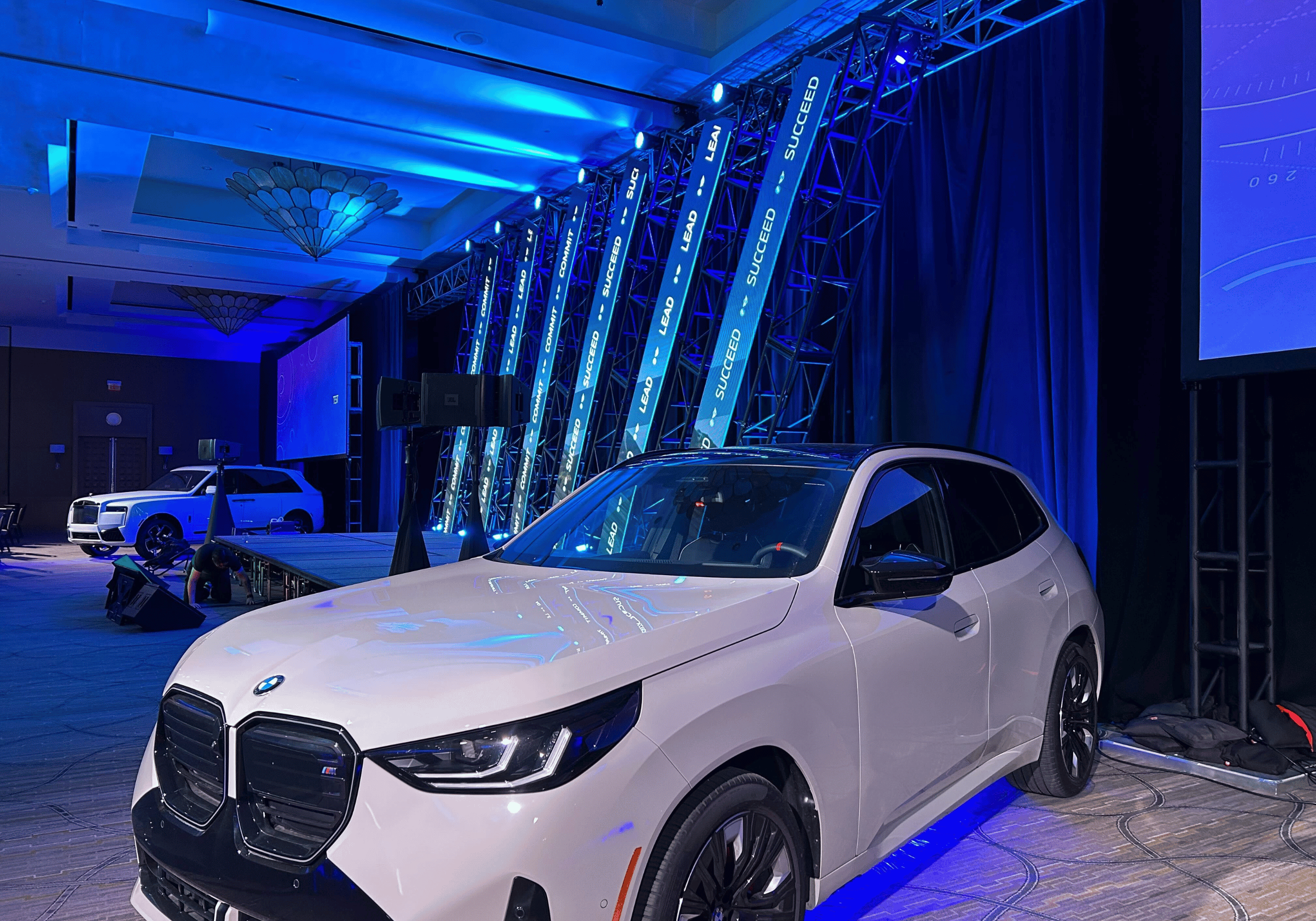 Image of a white BMW on display at BMW CCRC 2025