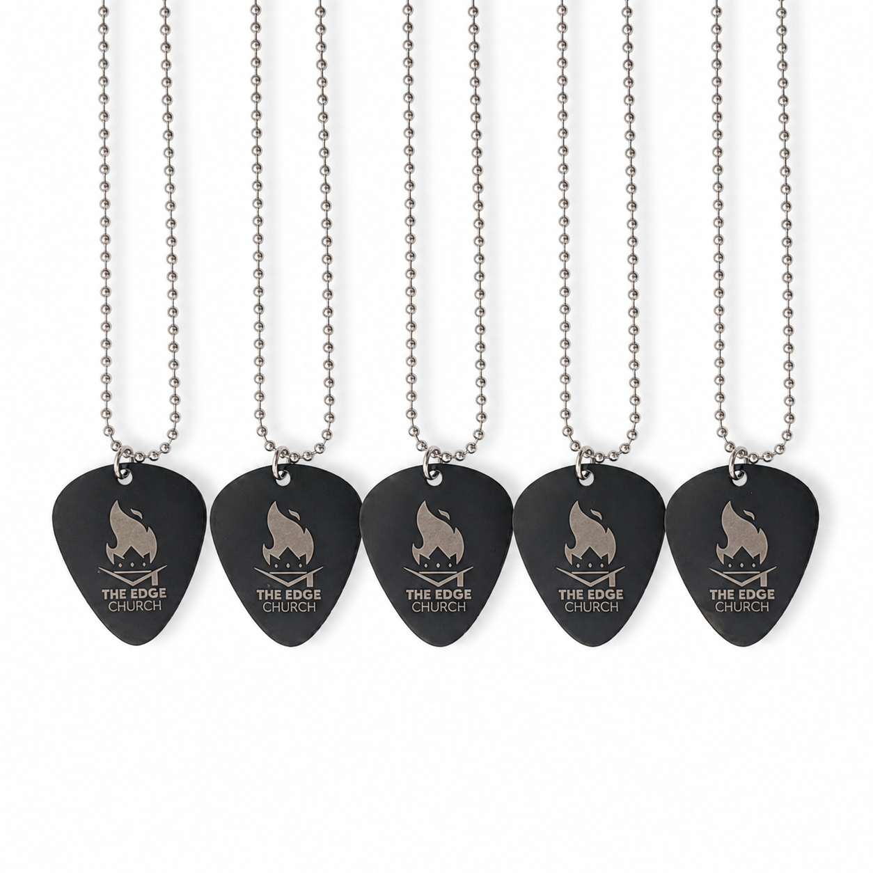Five guitar picks with chains hanging from a white background. Each pick has a logo of a campfire and the text "The Edge Church."