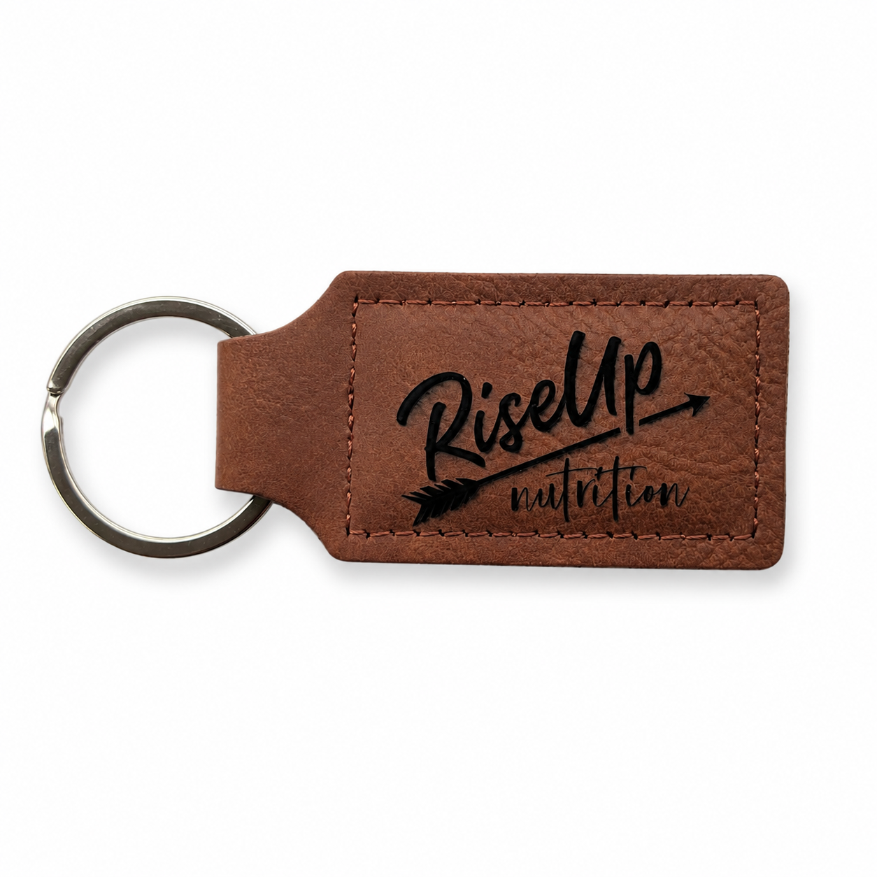 Brown leather keychain with black text that reads 'RiseUp nutrition' and an arrow design.