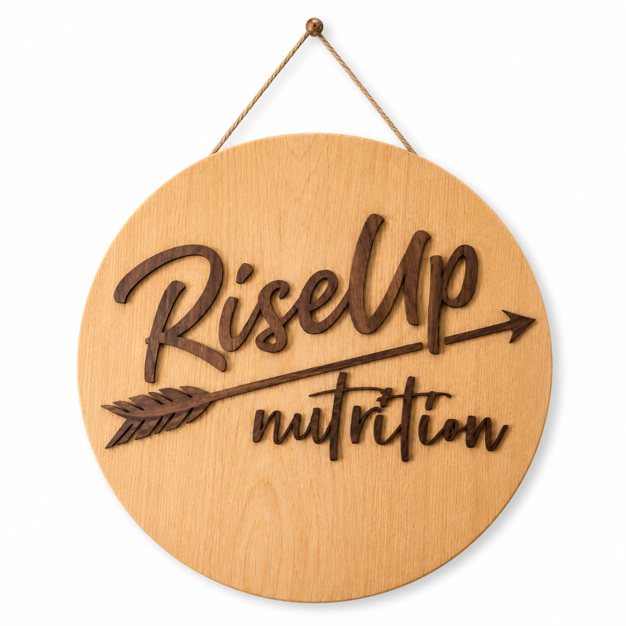 Wooden sign with the words 'Rise Up' and 'nutrition' written in cursive, and an arrow design, hanging on a white background.