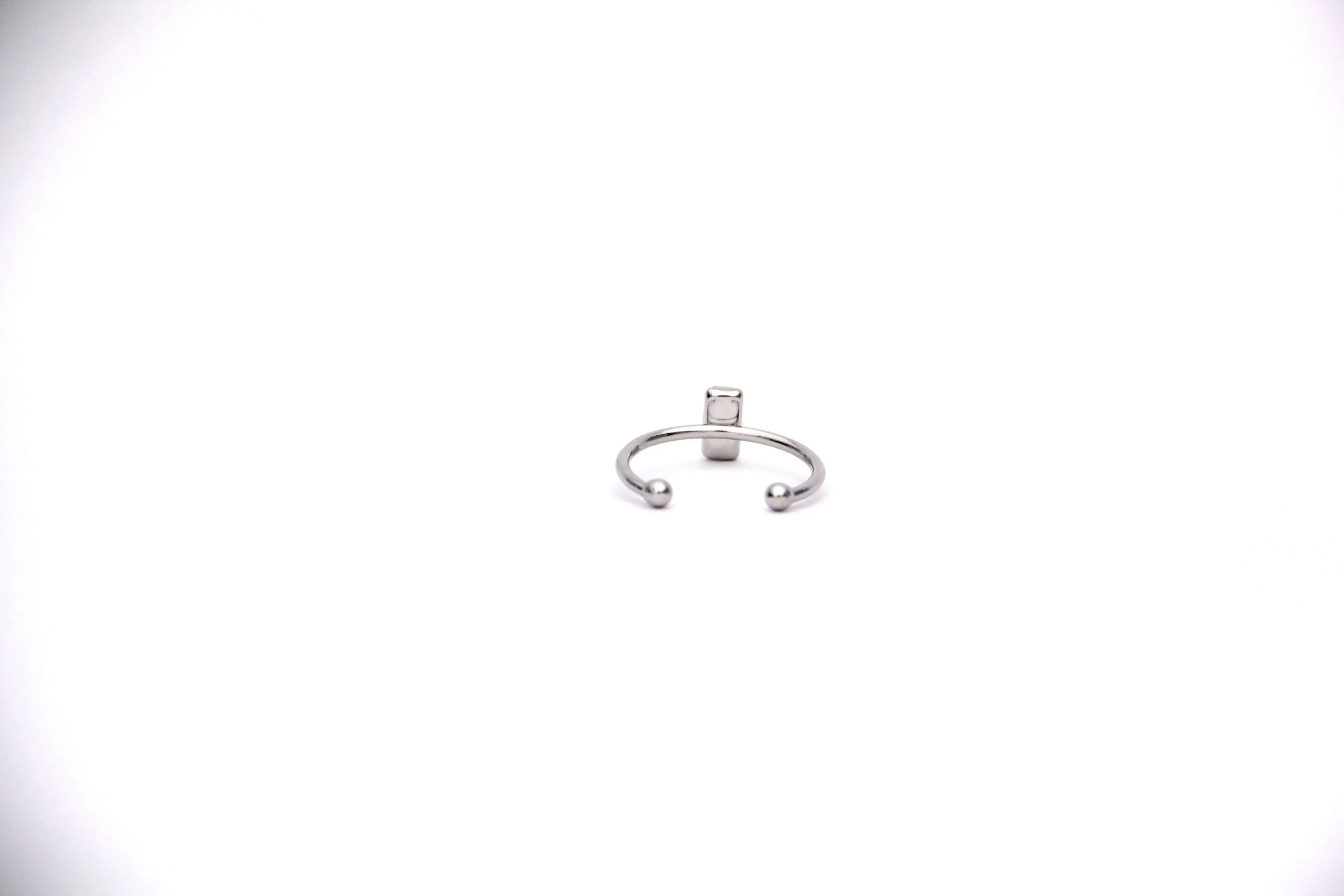 The back of a genuine hand collected sea salt ring on a white background.