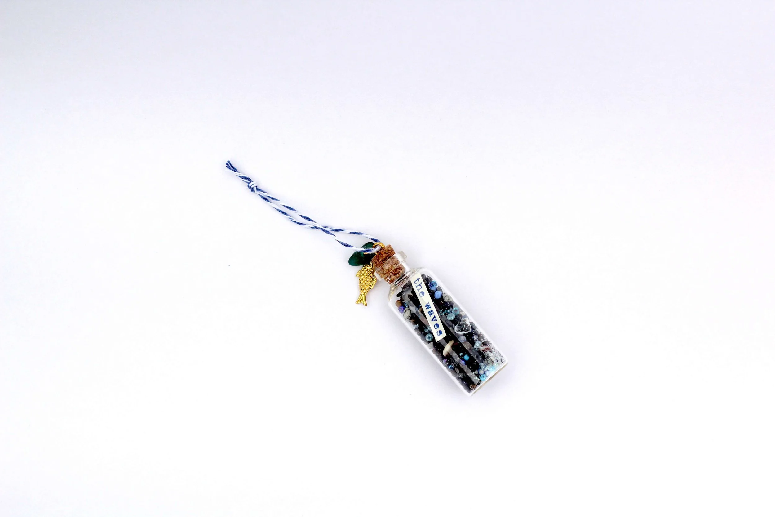 The Sardine Beach in a Bottle Ornament on a white background.