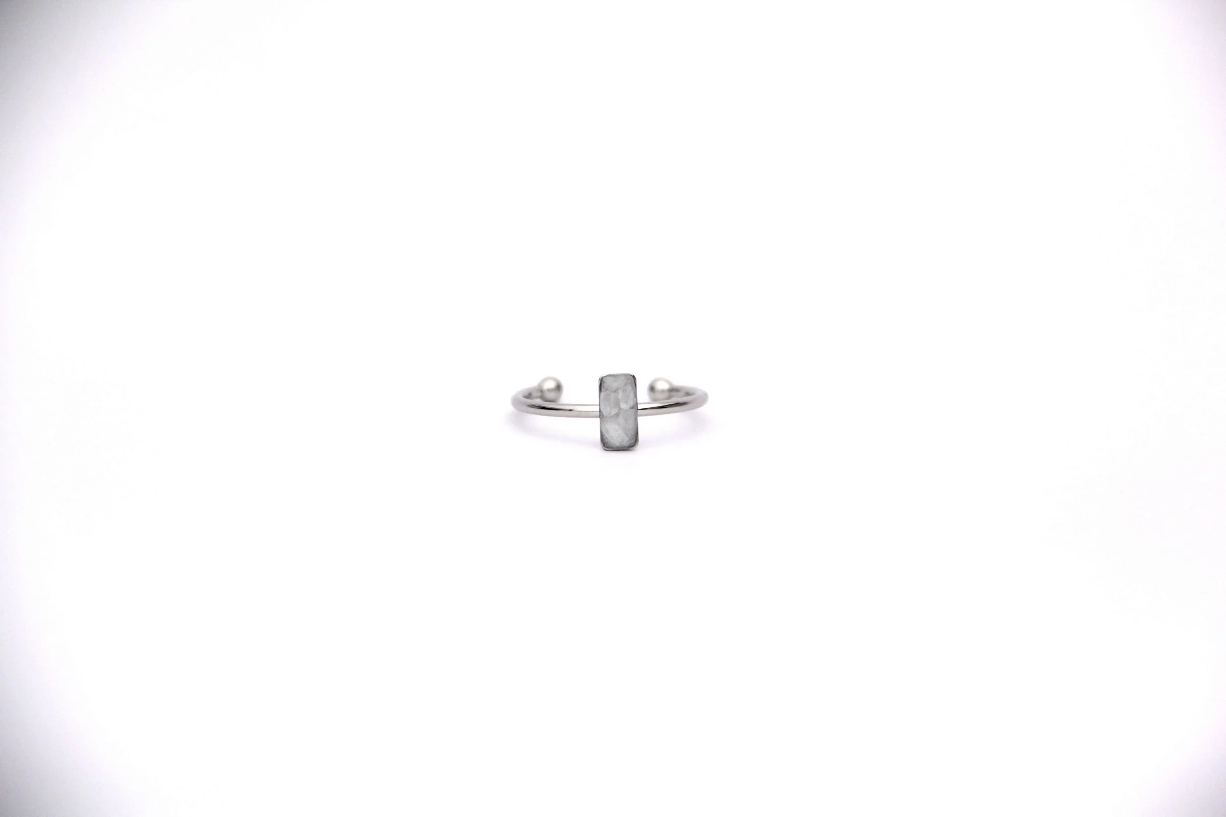 The front of a genuine hand collected sea salt ring on a white background.