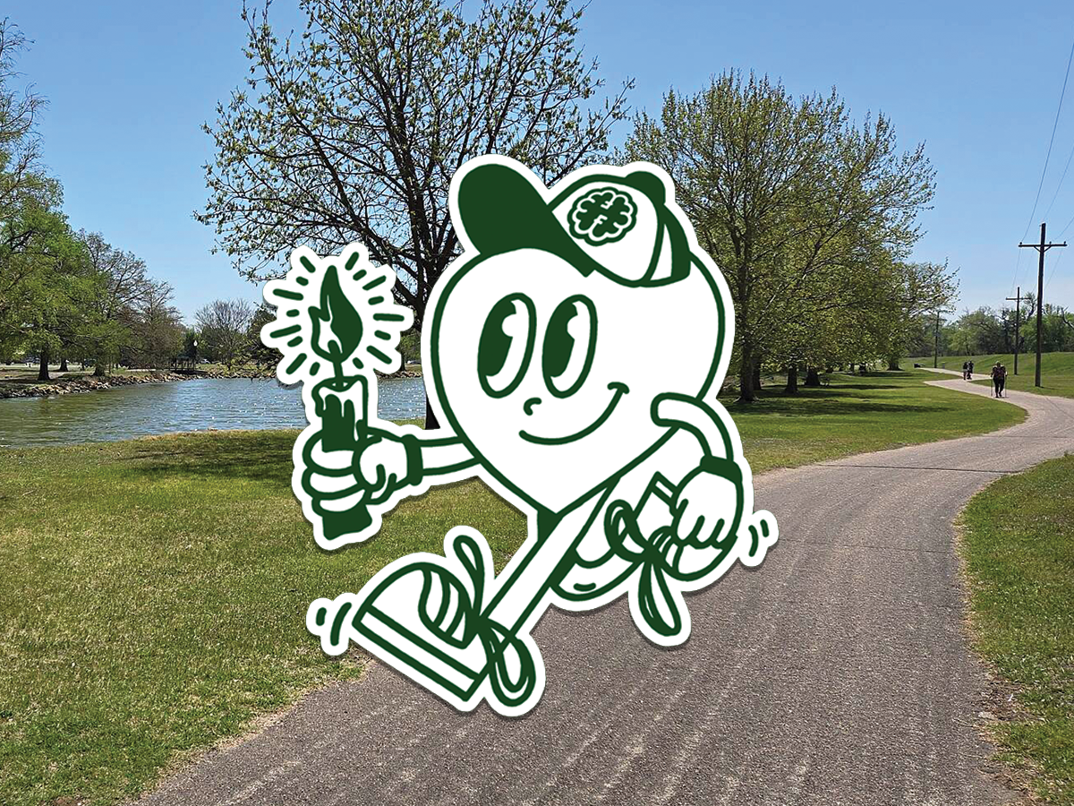 A cartoon heart character wearing a cap with a leaf and dollar sign, holding a lit candle, based on a photo of a park with a paved path, trees, and a pond under a clear blue sky.