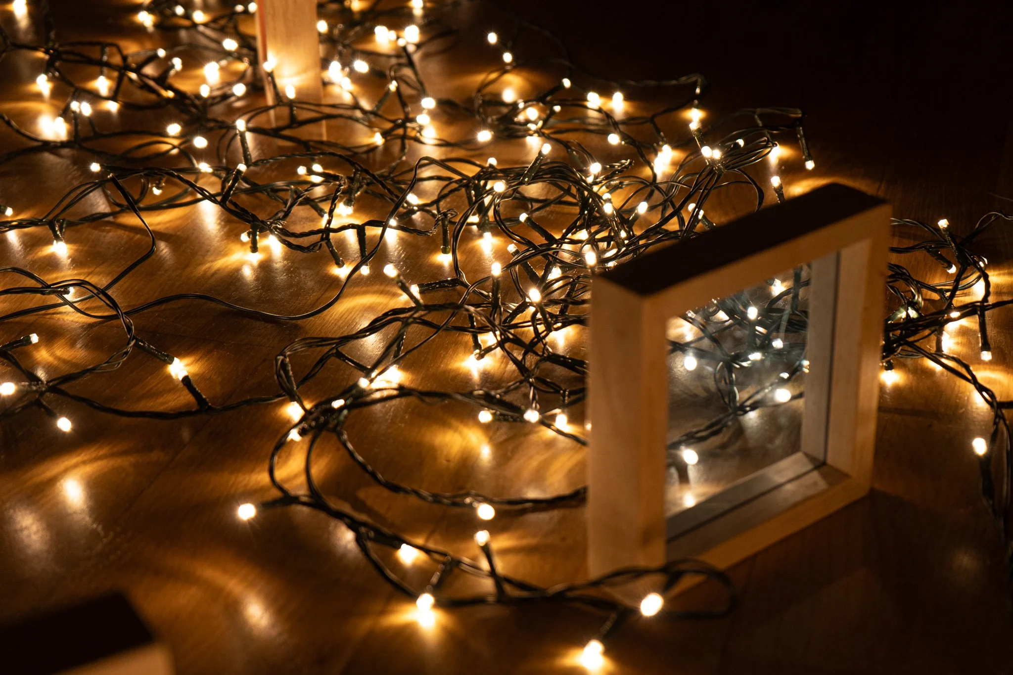 Fairy lights scattered across a laminate floor
