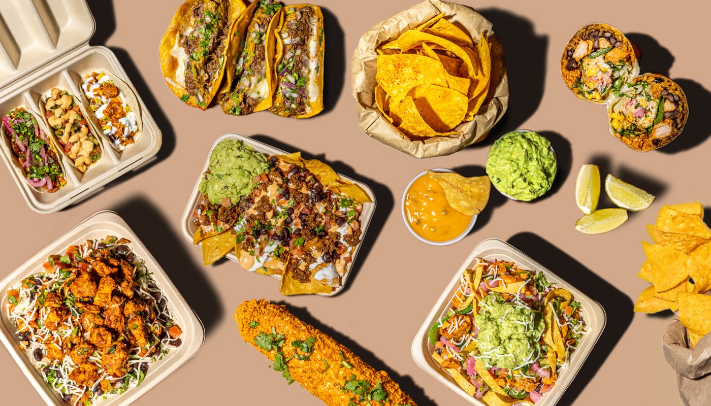 Assorted Mexican dishes including tacos, nachos, tacos, a taco with meat and guacamole, a bowl of shredded chicken, a burrito, a salad with guacamole, tortilla chips with queso, and sushi rolls, all on a beige background with lemon wedges and chips.