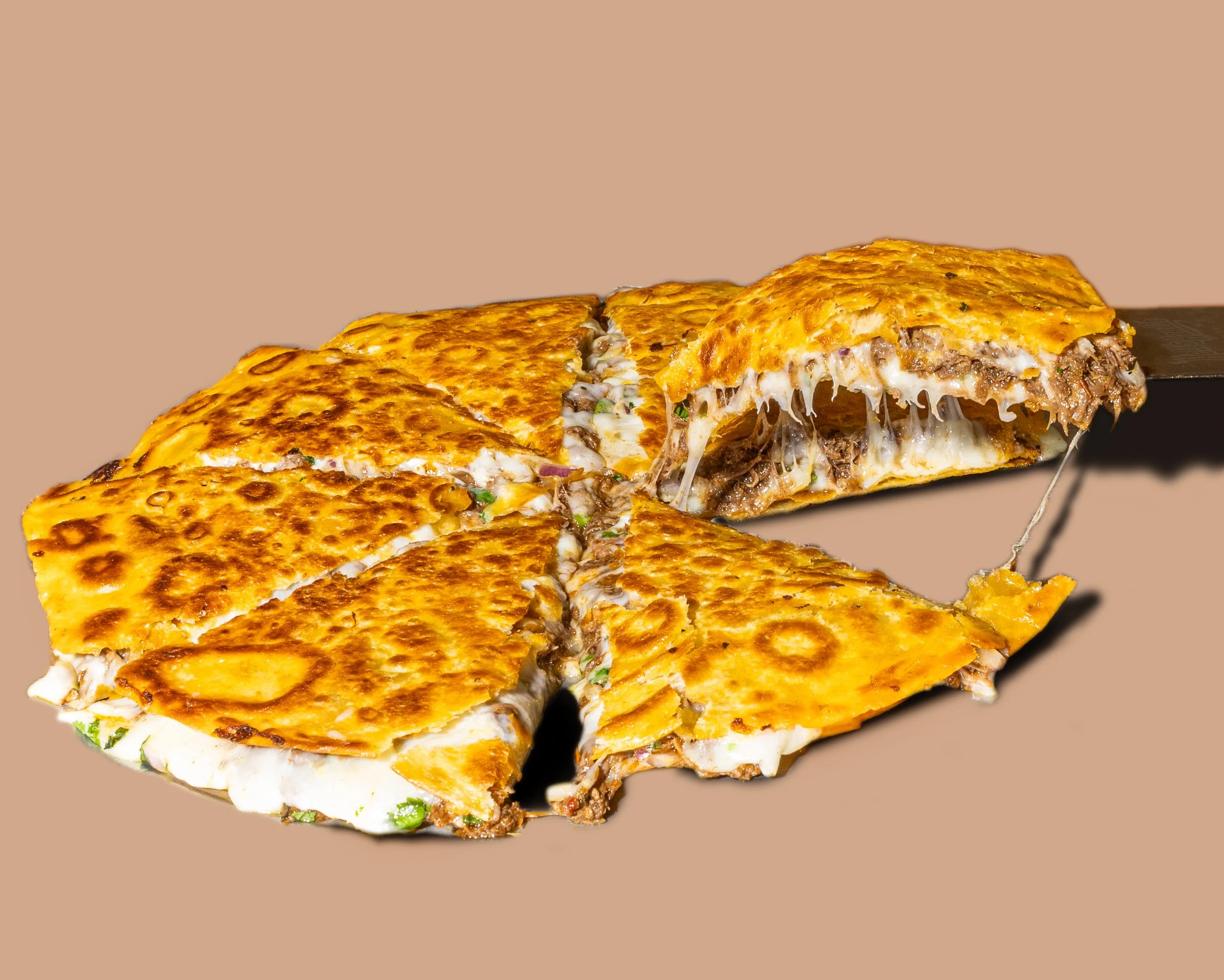 Slices of cheesy, meat-filled lasagna with a golden-brown top and gooey cheese stretching.