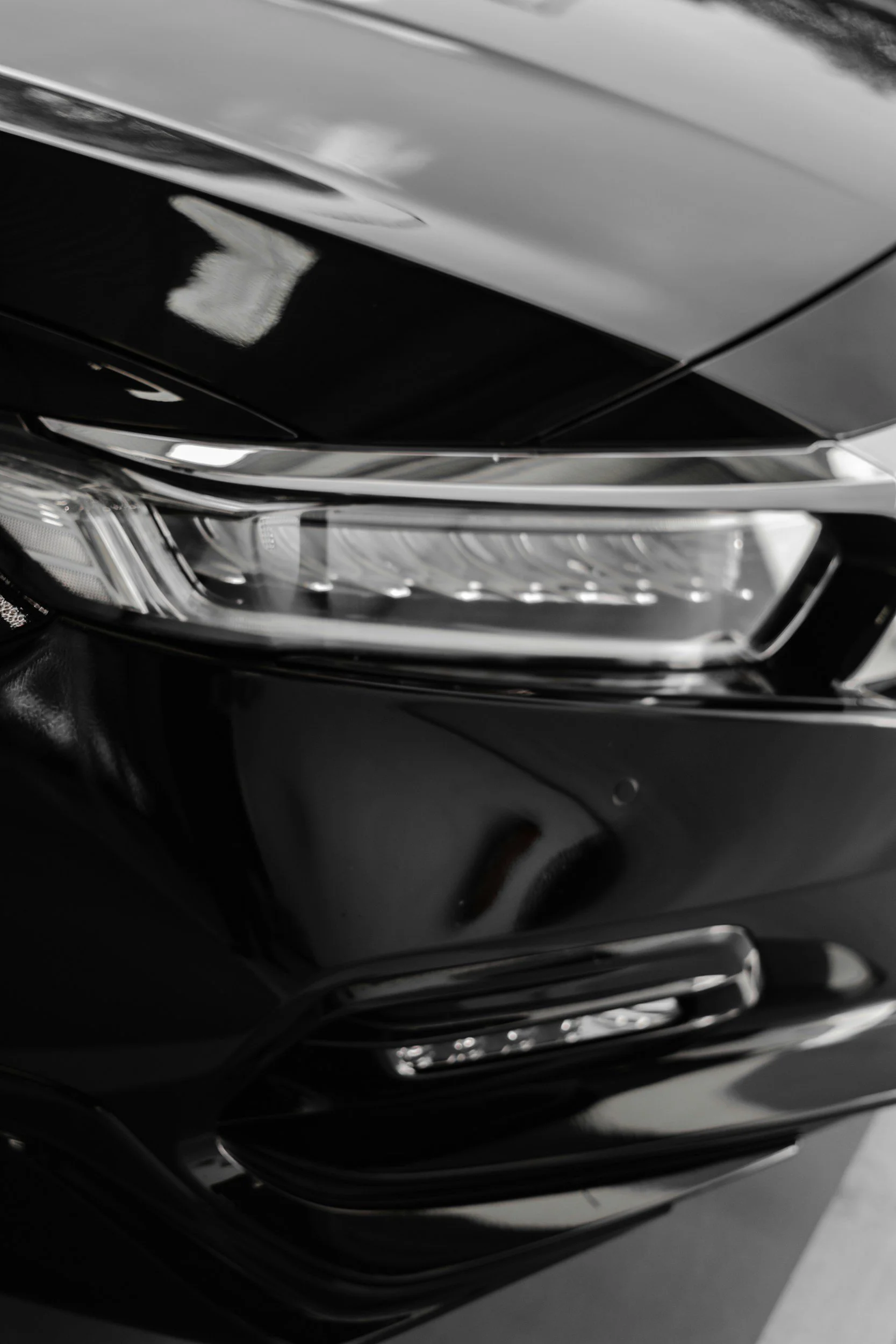 Bumper corner scuff repair on black car
