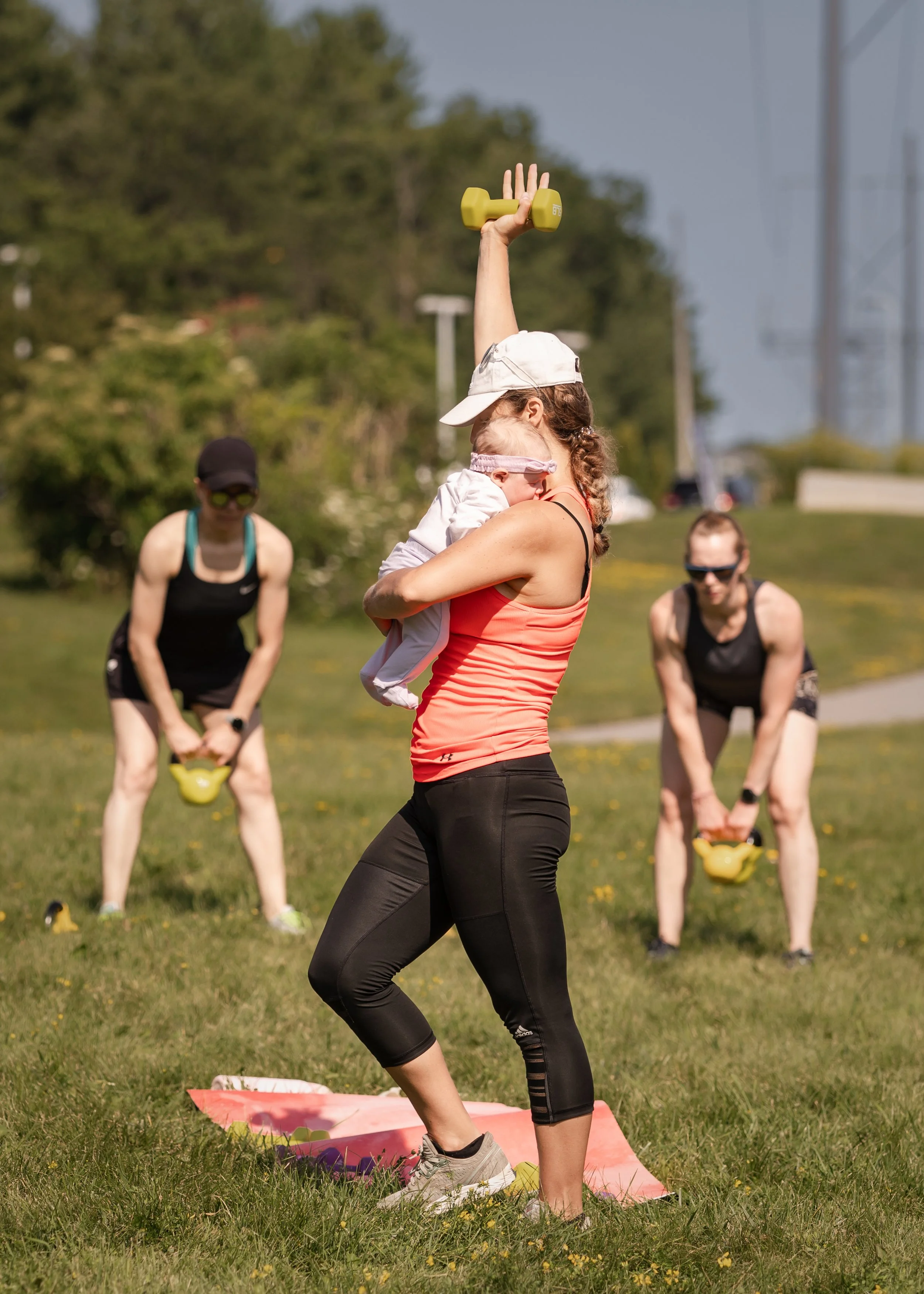 Participant performing a kettlebell exercise during Larch House Physio & Movement’s Fundamentals Series, a beginner-friendly community strength training program in Kanata, Ottawa.