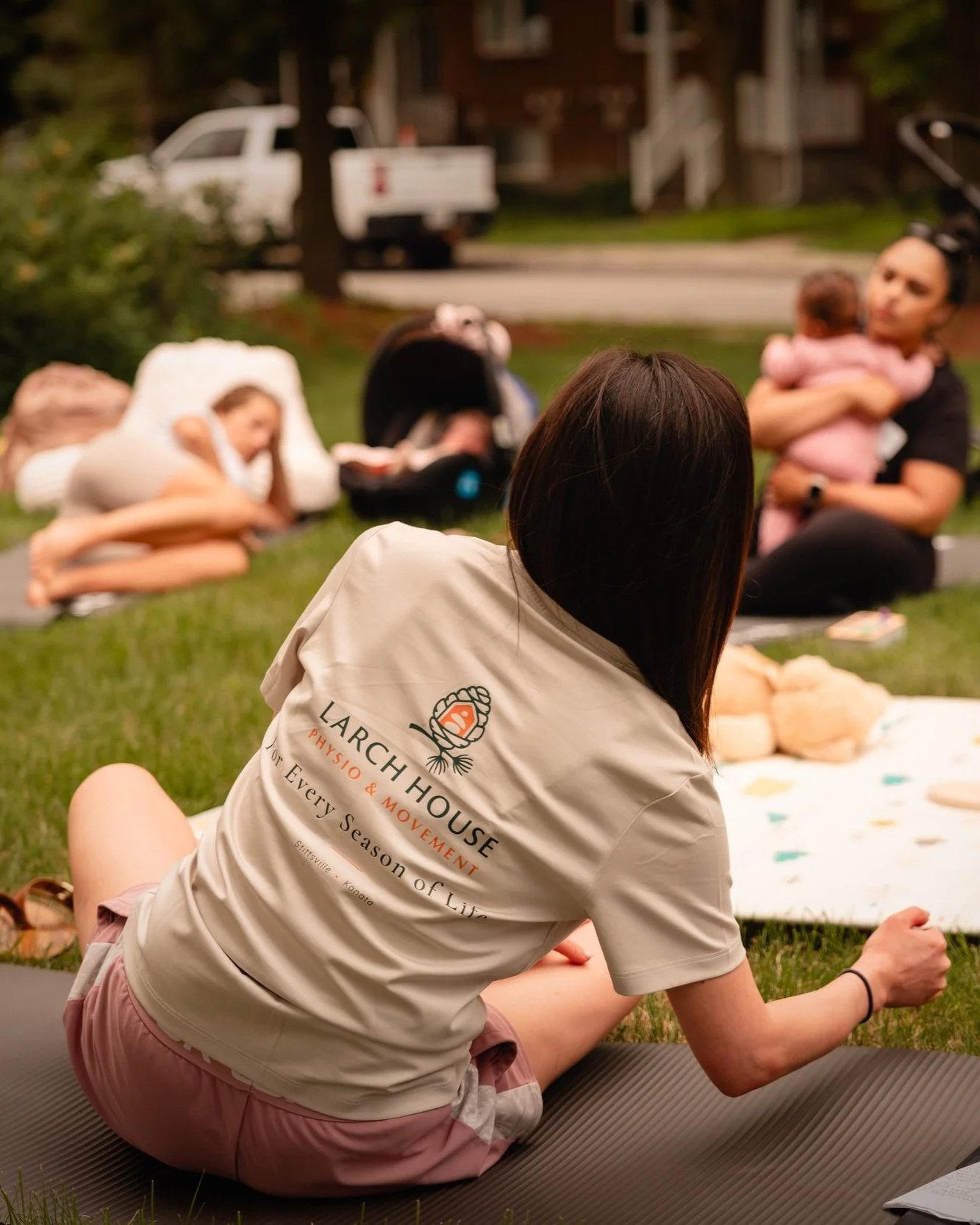 Larch House Physio & Movement community wellness event with families enjoying guided movement outdoors in Ottawa.