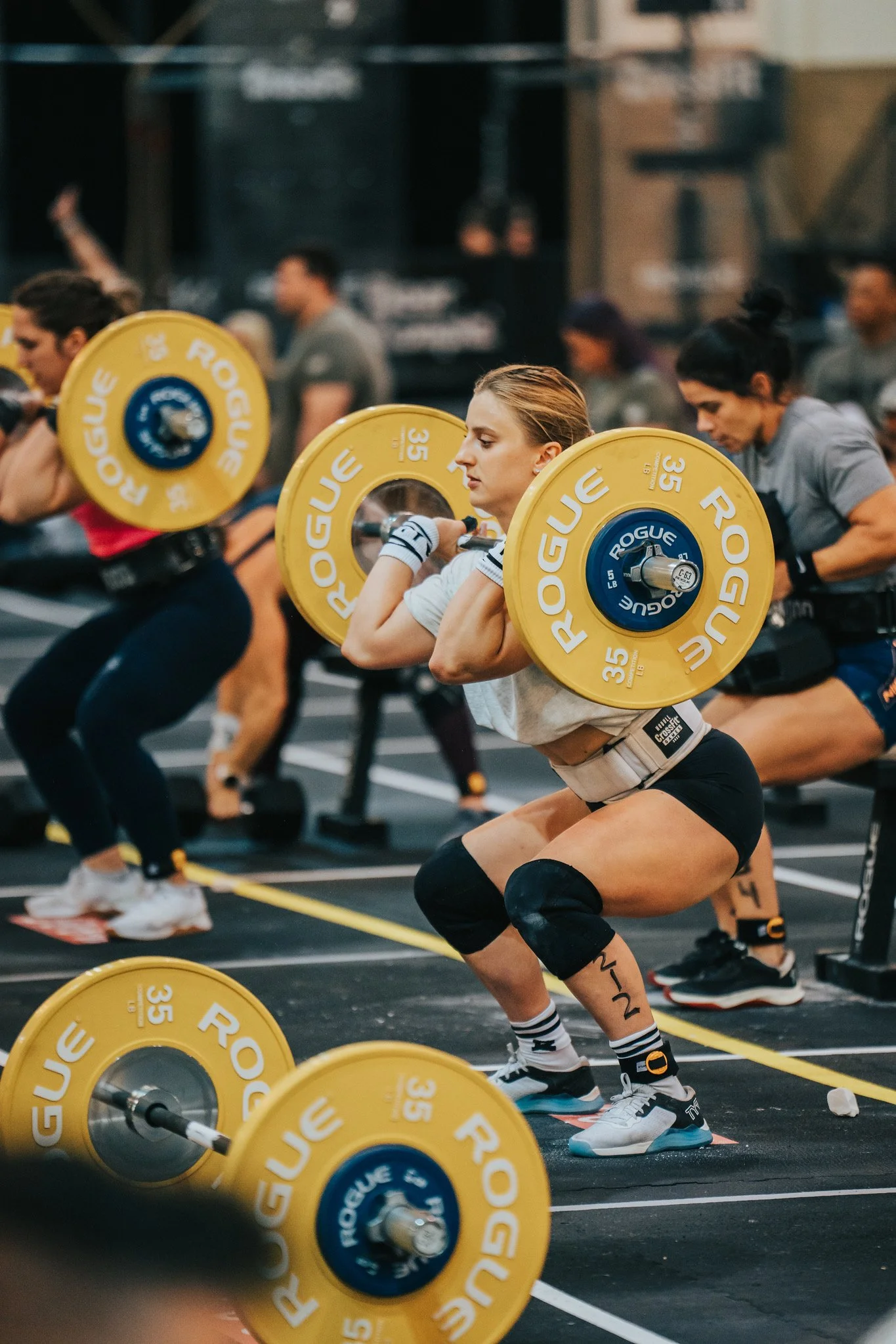 Freya Moosbrugger competing in CrossFit, performing a weighted squat during a strength event.