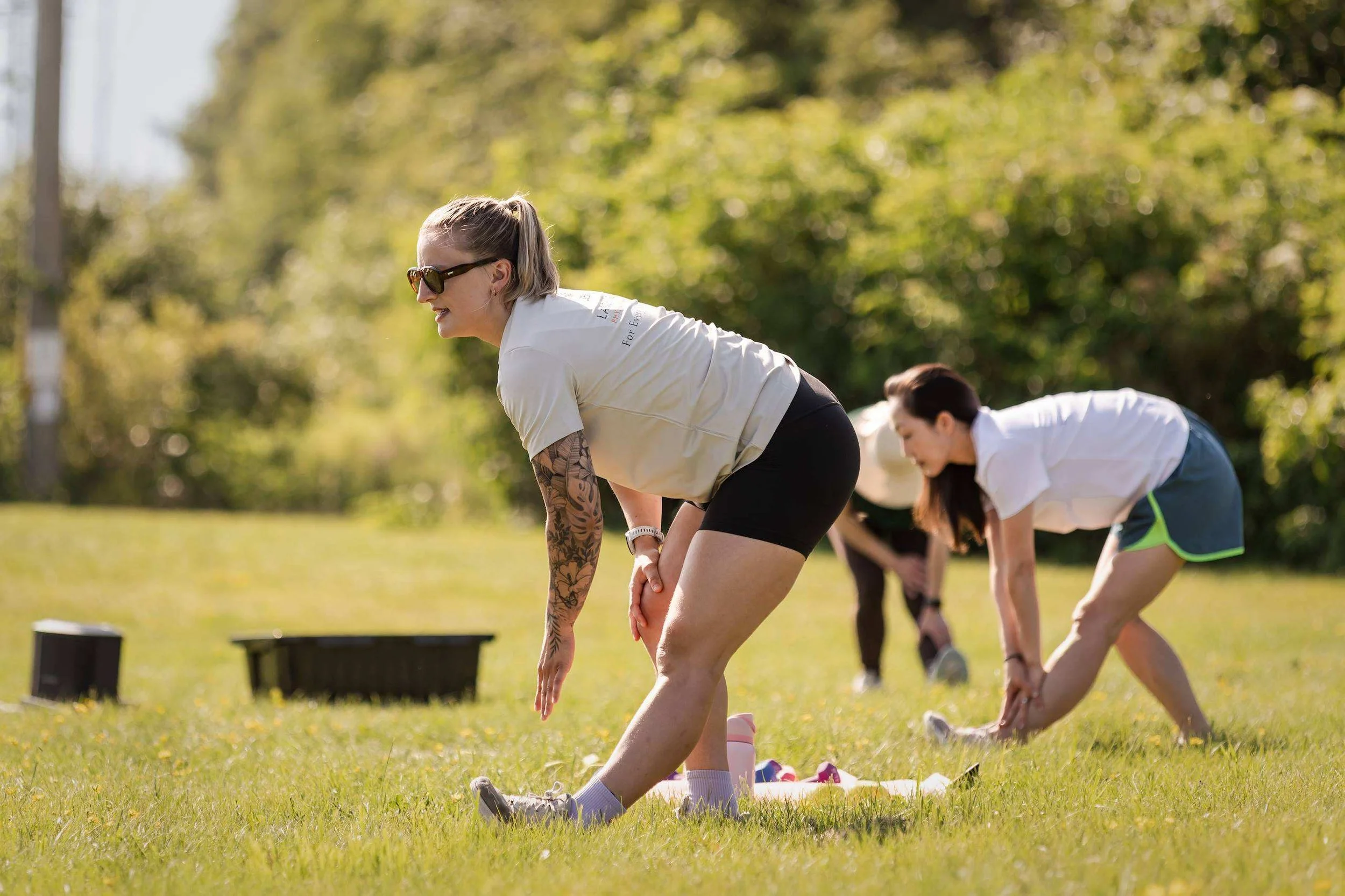 Freya Moosbrugger leading an outdoor strength and conditioning class.