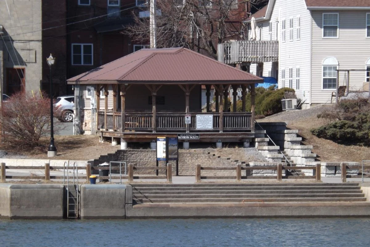 A photo of the dock and boathouse near the riverfront.