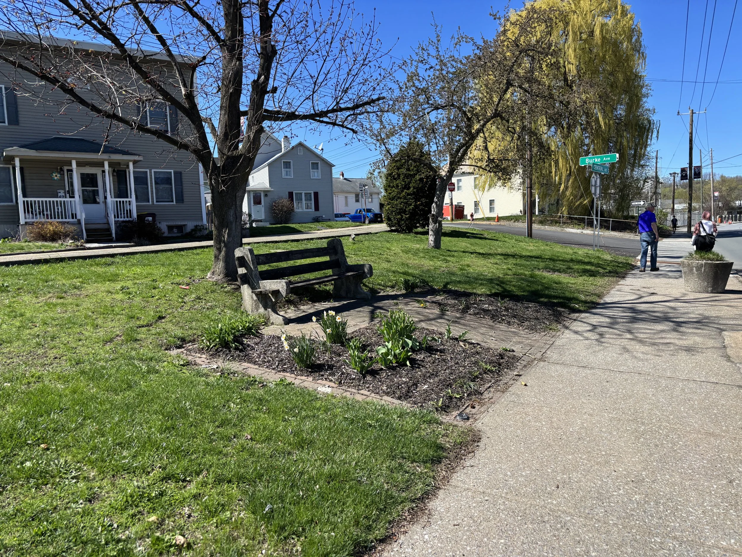 A photo of a bench along a sidewalk in Mechanicville.