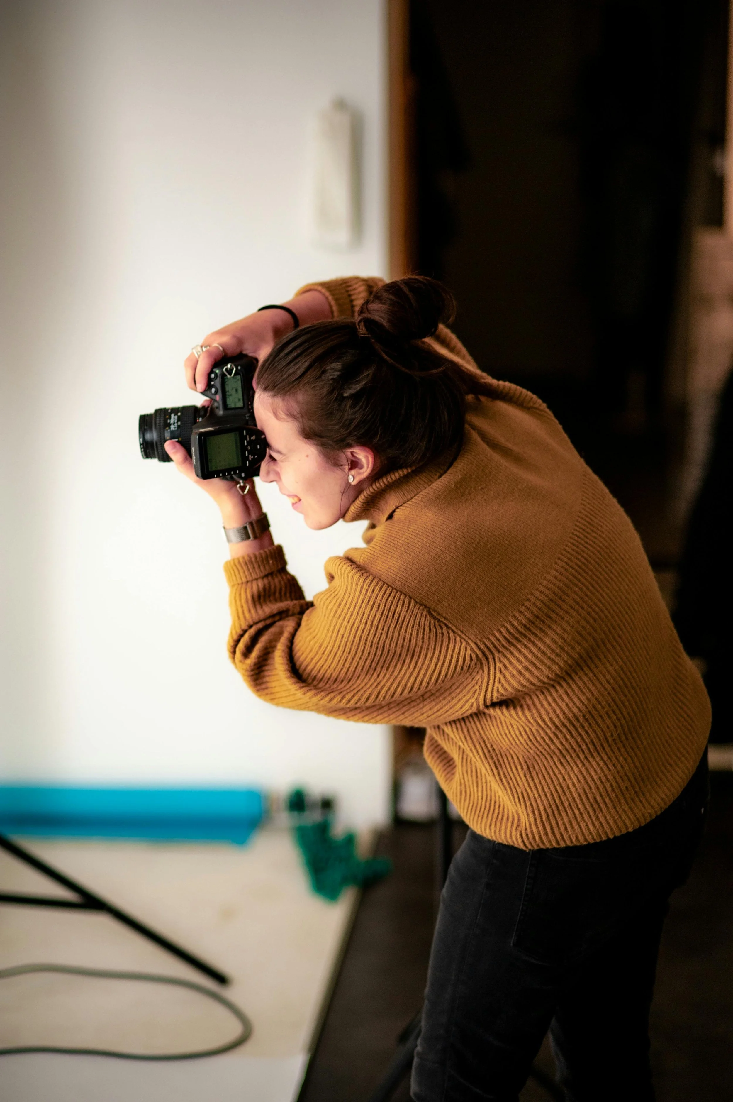 Woman focusing her camera in on one angle