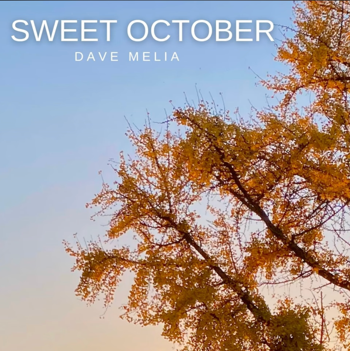 Cover of the song "Sweet October" by Dave Melia, featuring a tree with orange leaves against a blue sky during fall.