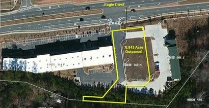 0.843 Acre developed commercial outparcel in Towne Lake, pad ready for retail/restaurant end user.  