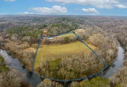20 Acres with over 900' frontage on the Etowah River zoned AG in Canton, GA.  