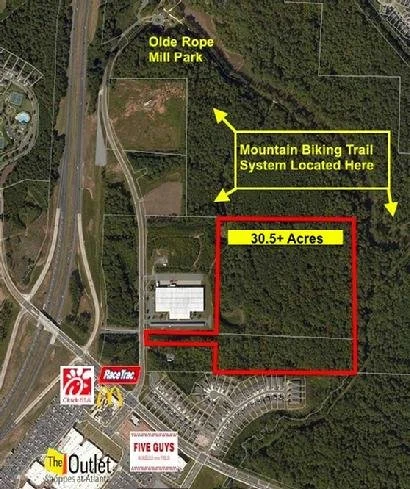 30.59 acres  Zoned for 132 across from the Woodstock Outlet Mall at Ridgewalk Parkway.  
