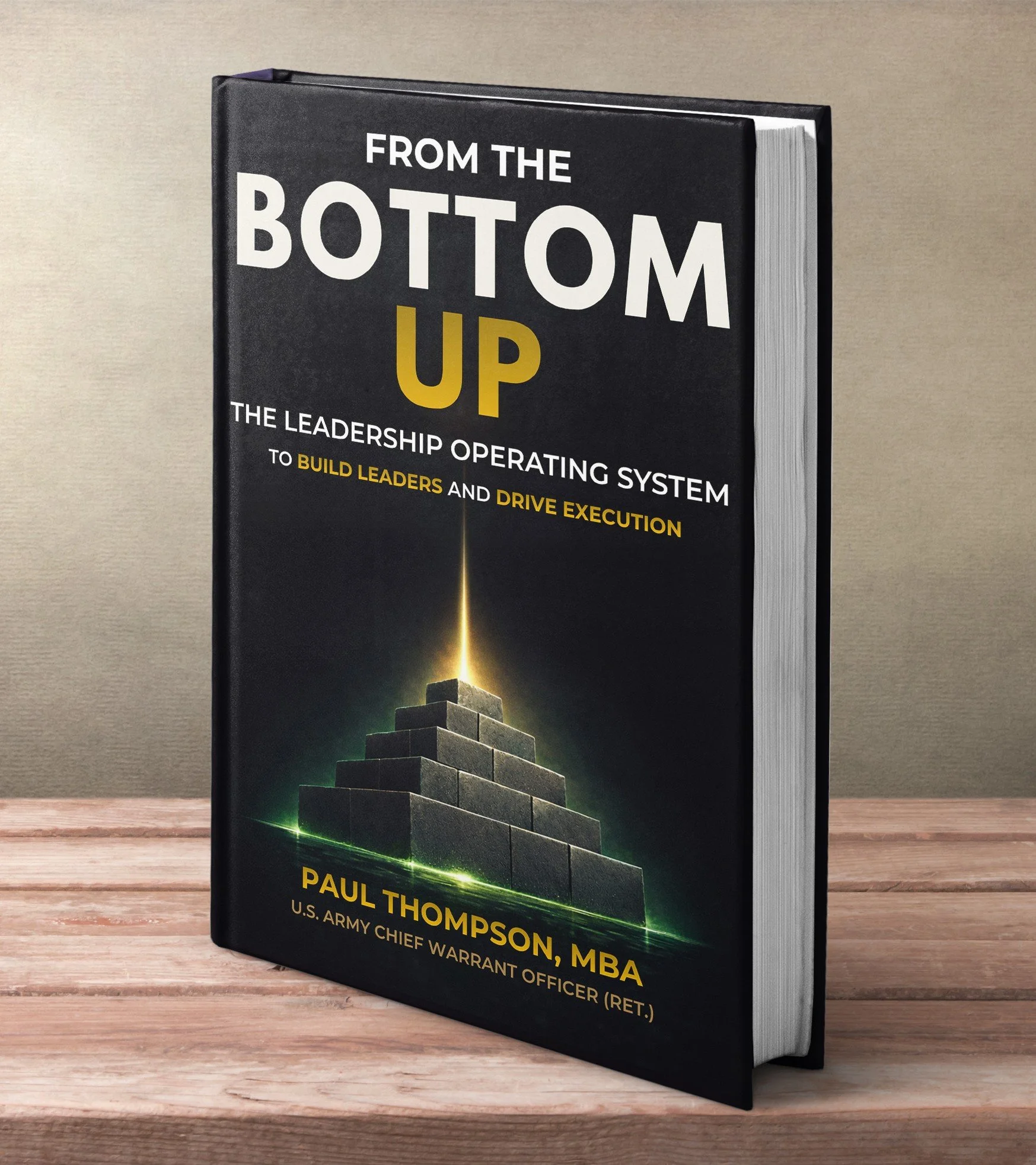 Book titled 'From the Bottom Up: The Leadership Operating System' by Paul Thompson, MBA, with a cover illustration of a pyramid made of bricks.