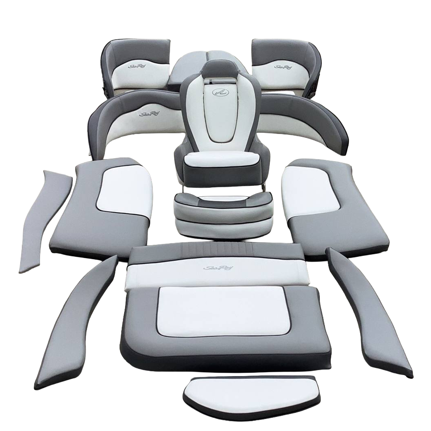 Disassembled gray and white outdoor furniture pieces arranged on concrete ground, including armrests, seat cushions, and backrests.