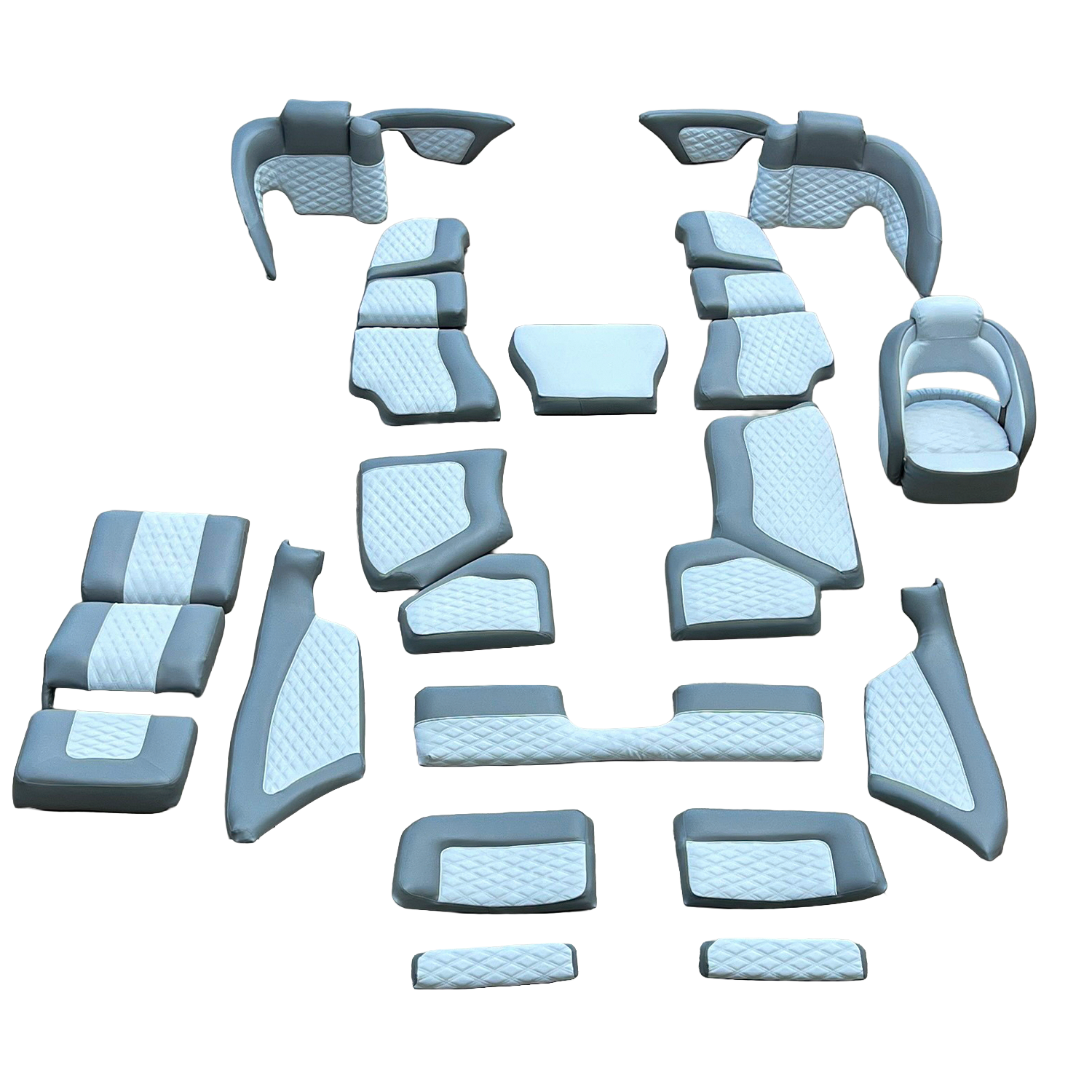 A 3D rendering of various cluster seating and lounge furniture pieces, arranged on a black background, including sofas, armchairs, and ottomans with gray and white quilted upholstery.