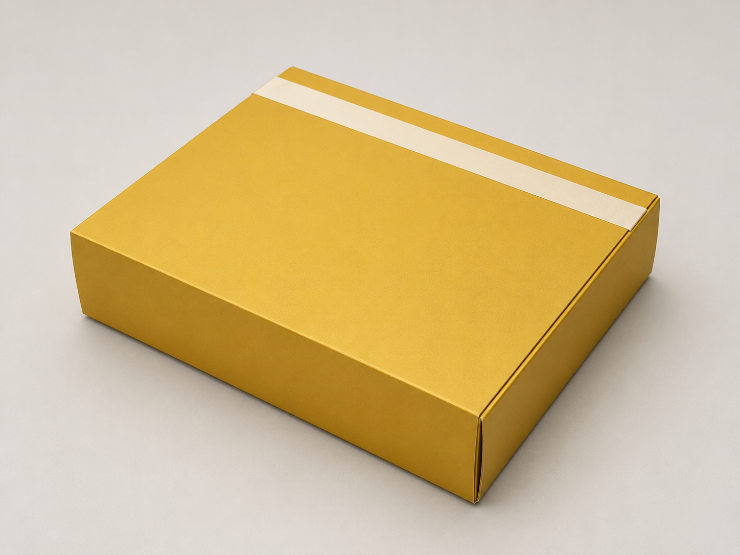 A yellow cardboard box with a white stripe on a light background.