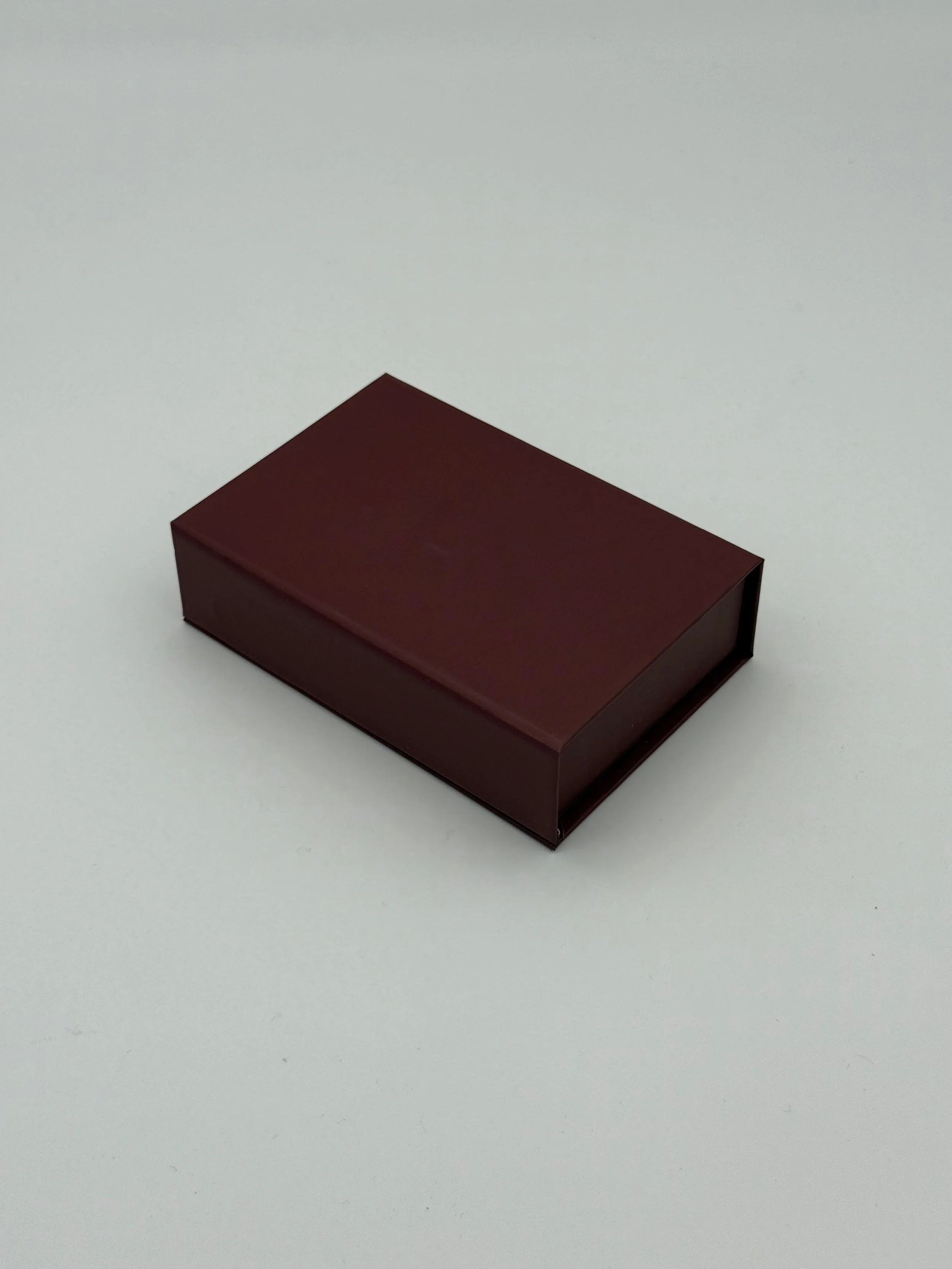 A rectangular maroon box on a plain white background.