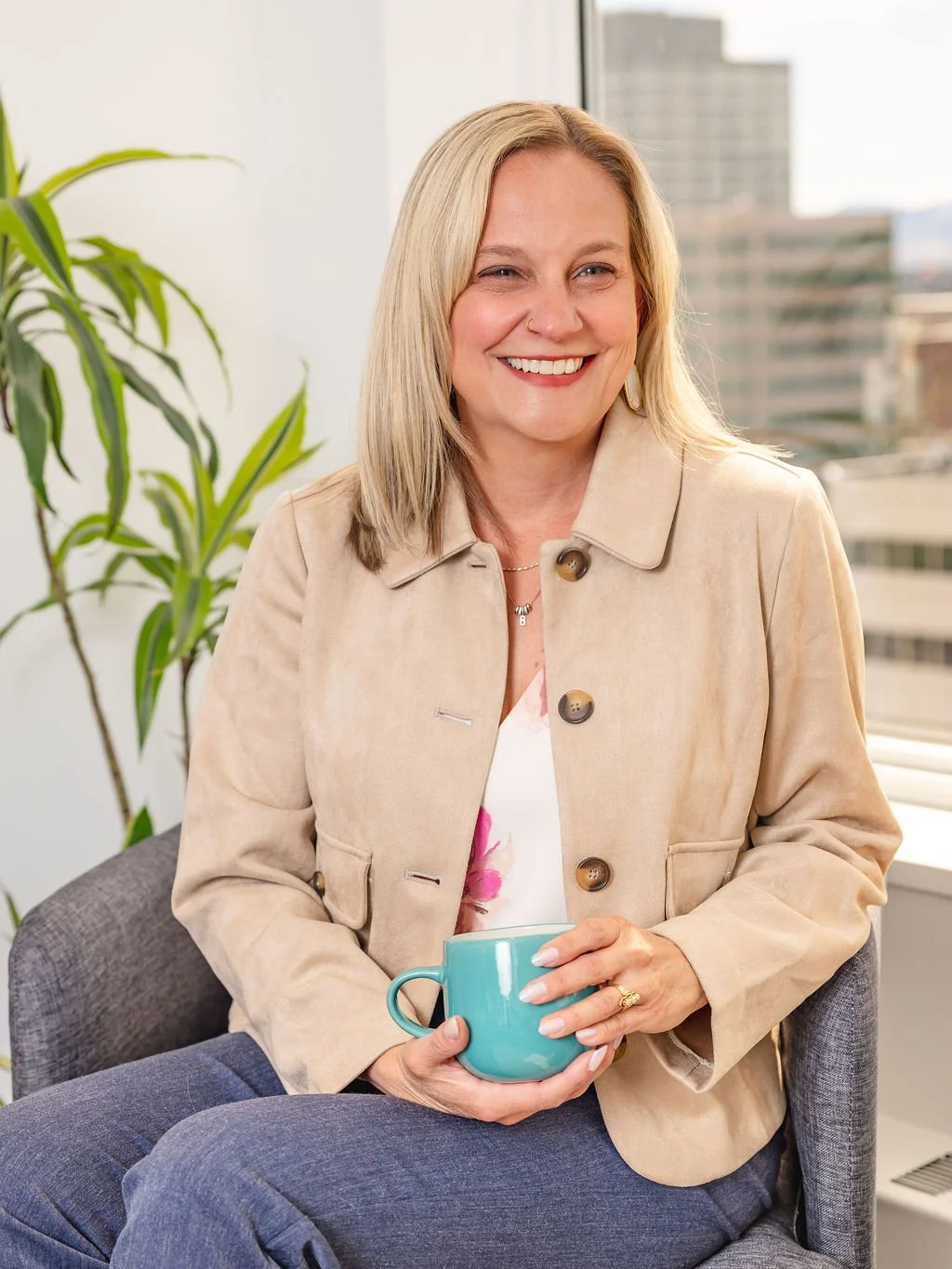 Portrait of Brittny Wilson, founder of Rooted Hire smiling in office setting
