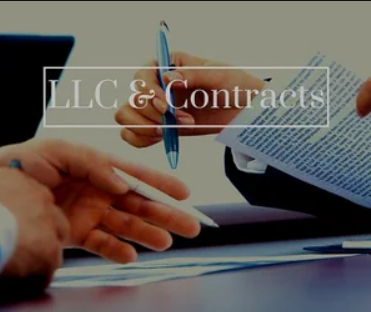 Close-up of two people exchanging or signing documents related to LLC and contracts, with one person holding a pen