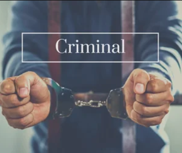 Person in a hoodie holding handcuffs with the word 'Criminal' overlayed on the image.