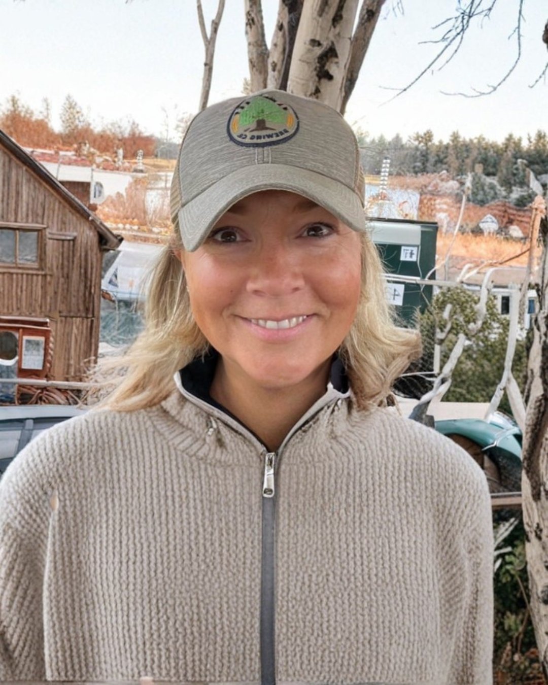 Happy customer of Jess Regan Creative Arts, blonde woman in baseball cap