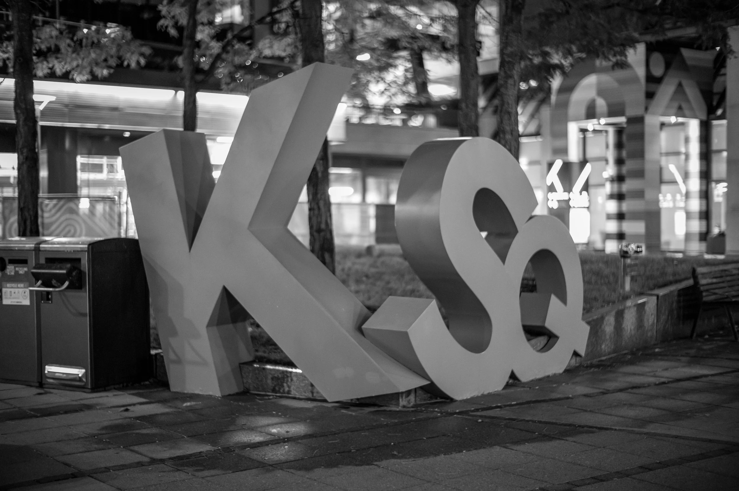 Large sculptural letters spell Kendall Square against a city skyline.