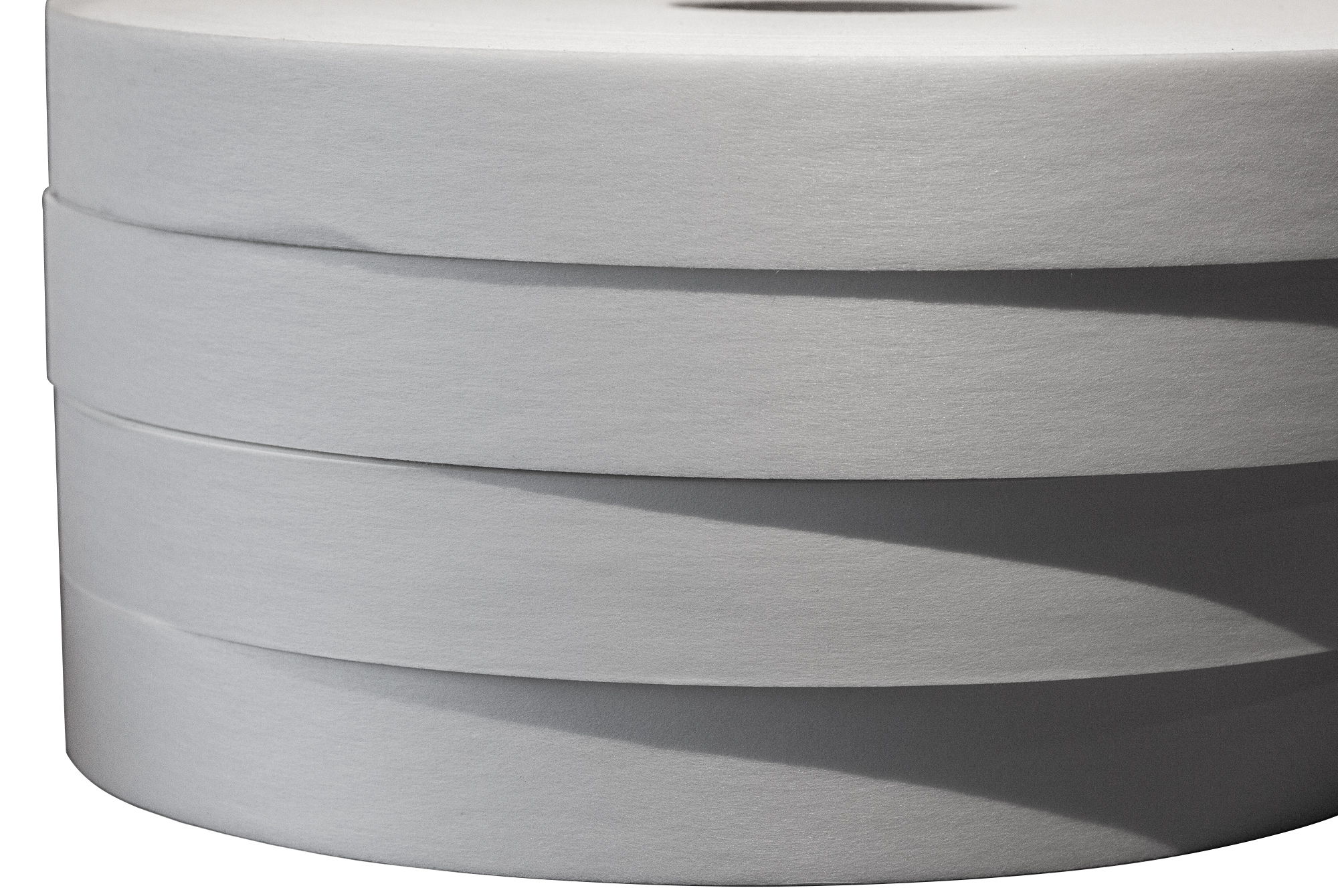 Close-up view of stacked white paper plates.