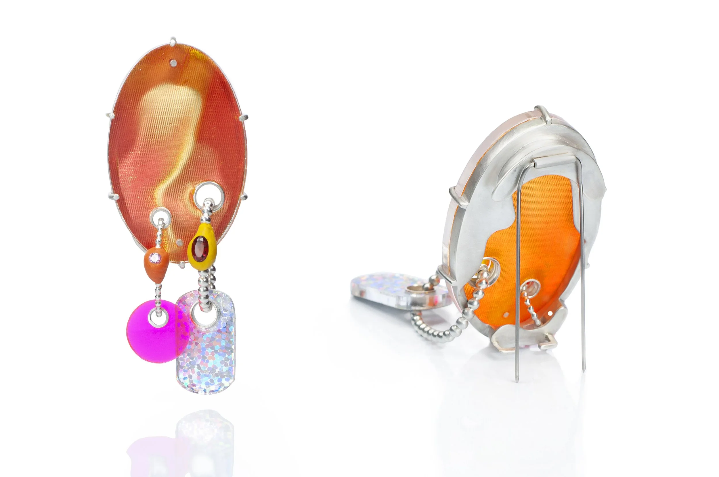 orange and sterling silver brooch with dangling shapes