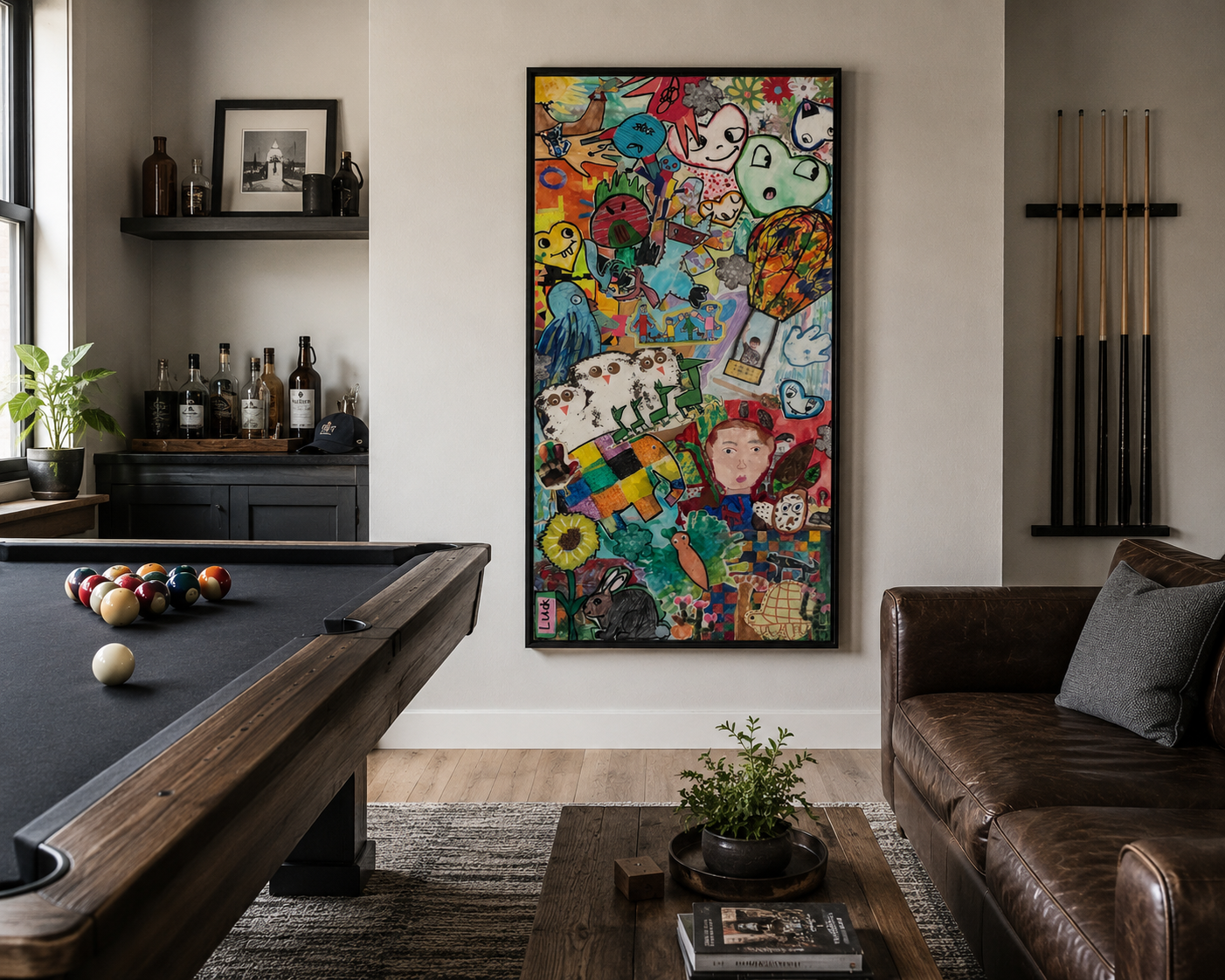 Interior of a living room with a pool table, a brown leather couch, a statement mural of colorful cartoon characters, and a shelf with bottles and framed art.