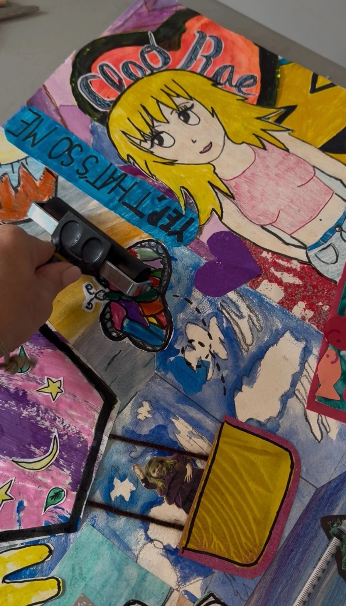 Colorful artwork featuring a cartoon girl with blonde hair, a butterfly, and various decorative elements including text that reads "Good Vibe" and "Kindness".