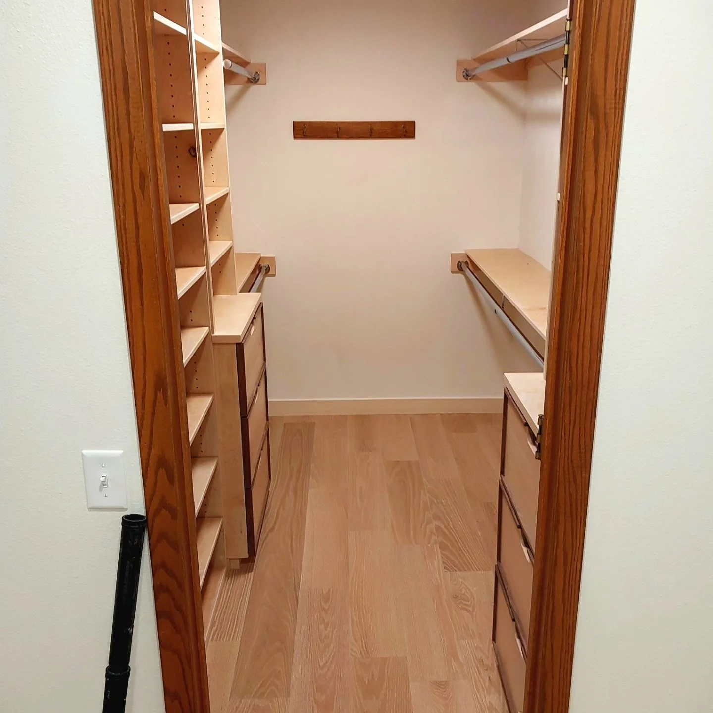 Closet build-out. Mostly maple with walnut accents and a lot of adjustable shelves.