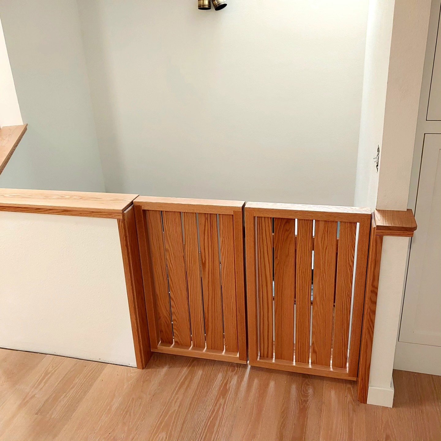 Baby gate made out of red oak.