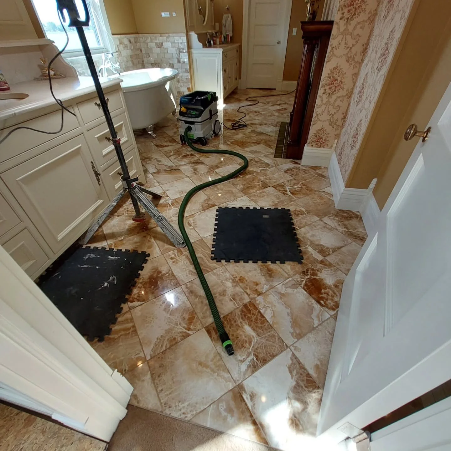 Regrouted natural stone tile floor.