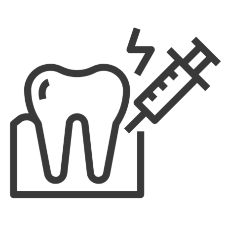 Tooth being treated with a syringe for dental anesthesia.