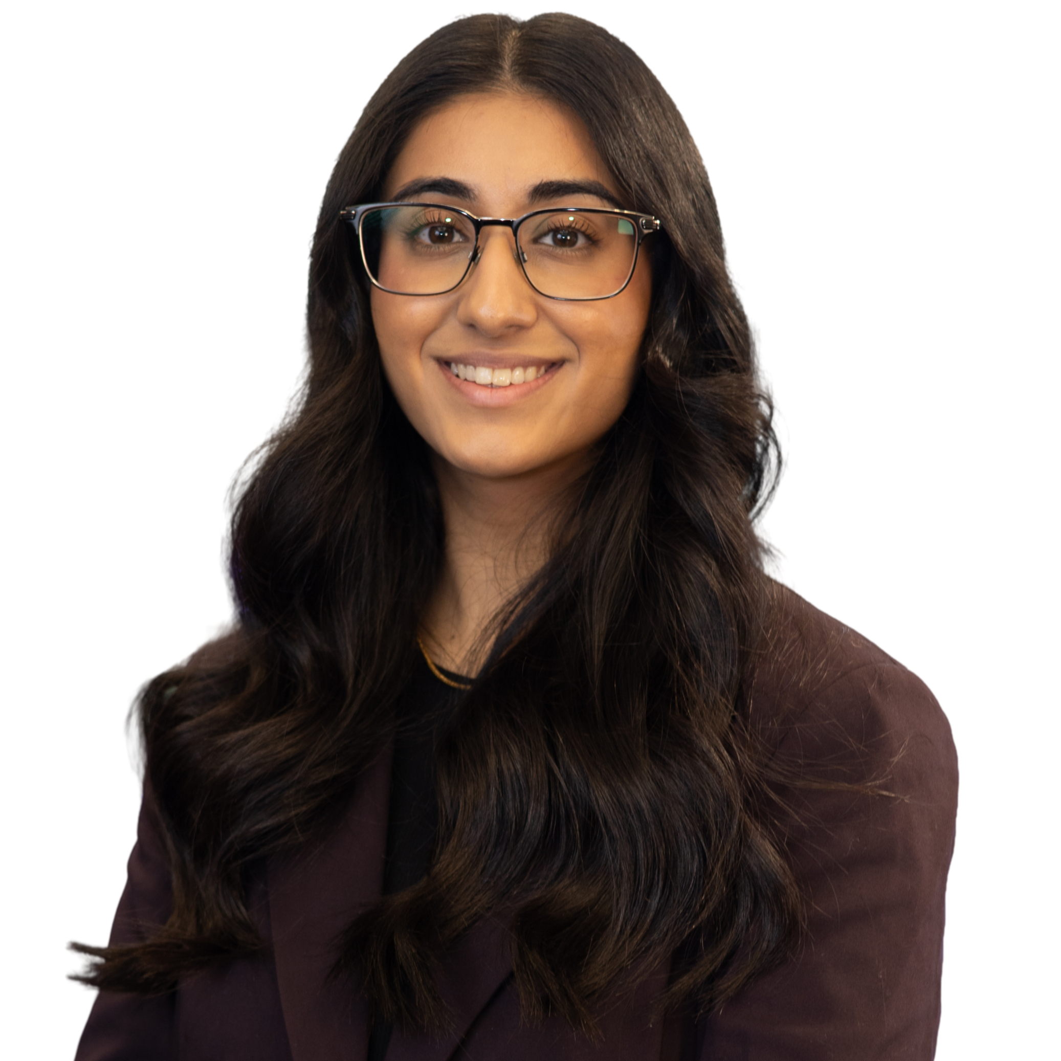 Close-up of a young woman with long dark hair, glasses, and a warm smile.