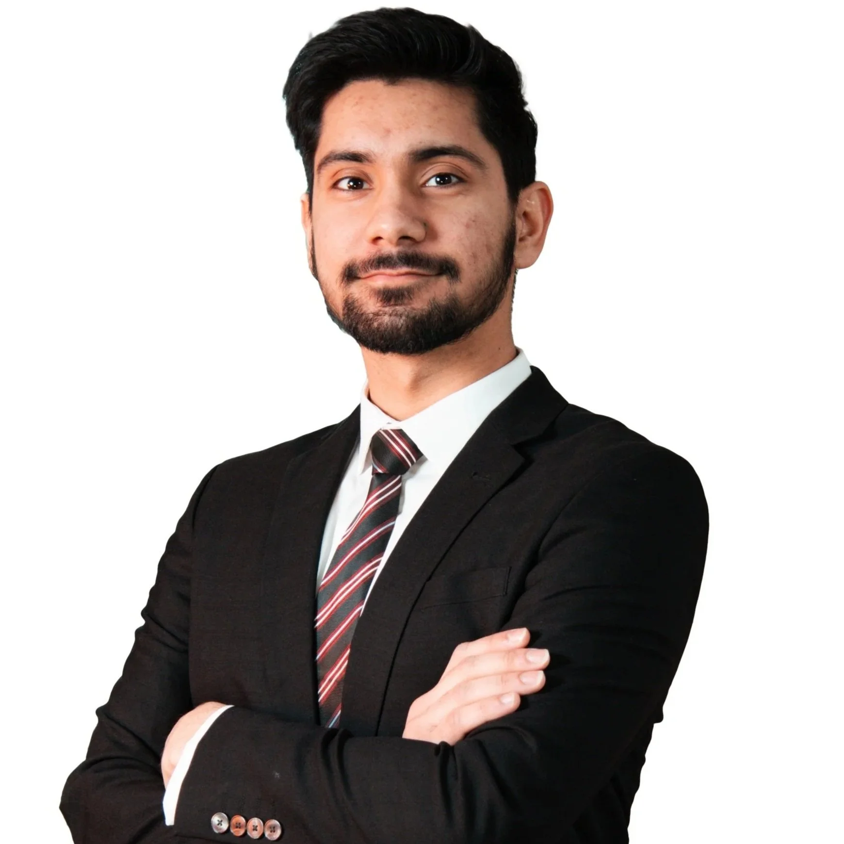 Professional young man in a black suit, white shirt, and striped tie, with arms crossed, looking confidently at the camera.