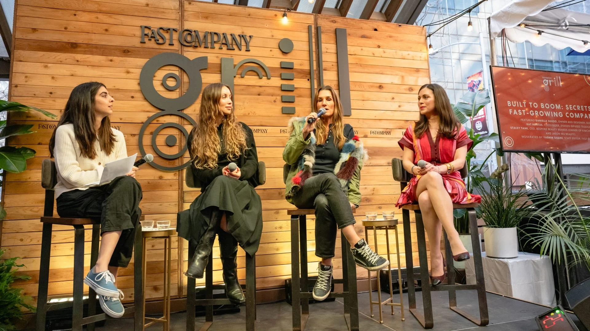 Four women, including CEO Stacey Tank, 21Seeds founder Kat Hantas and Danielle Guizio, sitting on stage during a SxSW panel discussion in Austin, Texas at the Fast Company Grill. One woman is speaking into a microphone, while others listen.