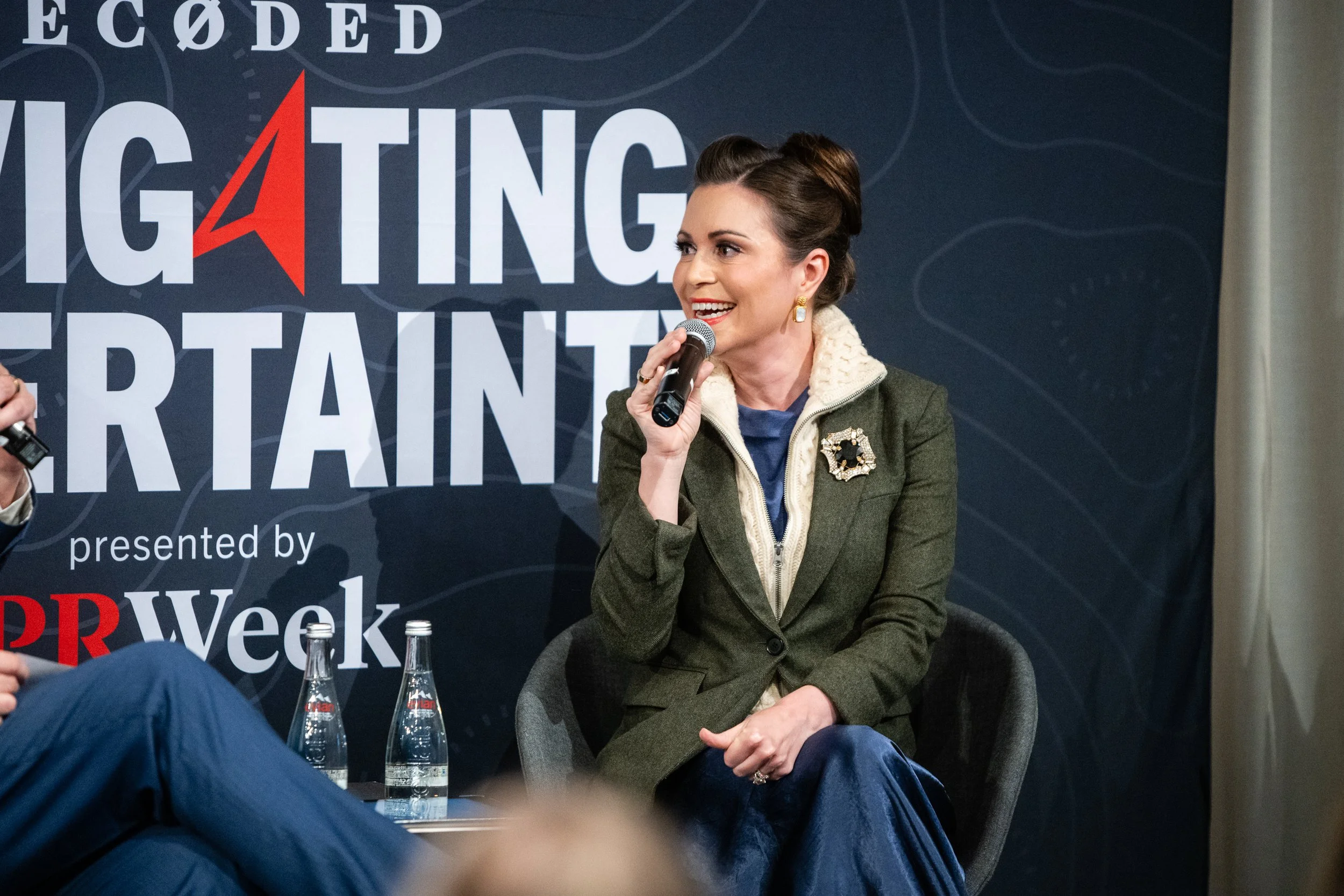 CEO, executive and board director Stacey Tank speaking at a conference on-stage.