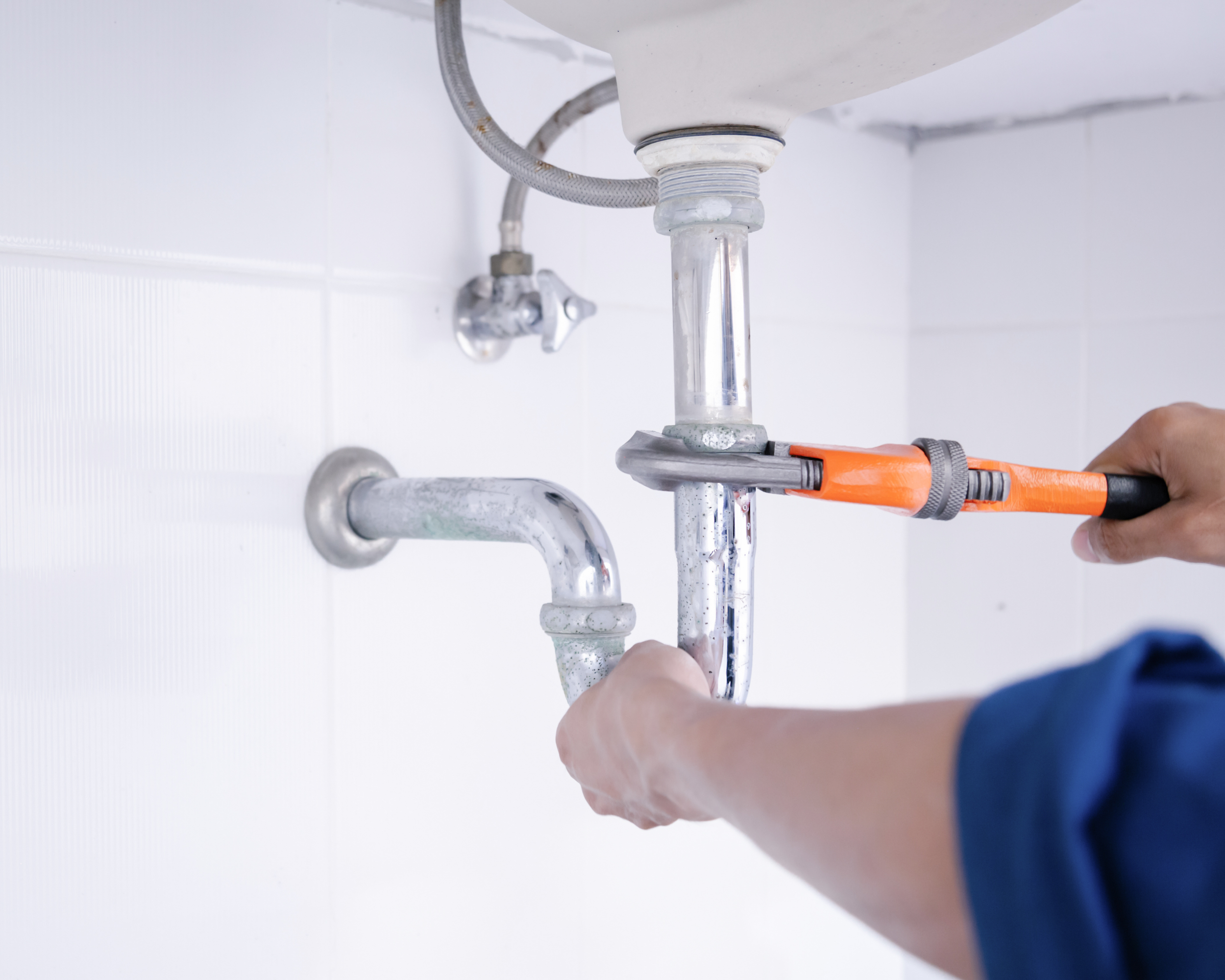 Plumber fixing a pipe