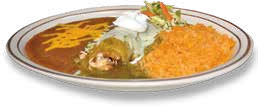 Plate of Mexican food with rice, refried beans topped with cheese, a cheese enchilada, and garnished with sour cream and shredded lettuce