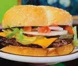 Close-up of a cheeseburger with lettuce, tomato, pickles, cheese, and a beef patty on a bun